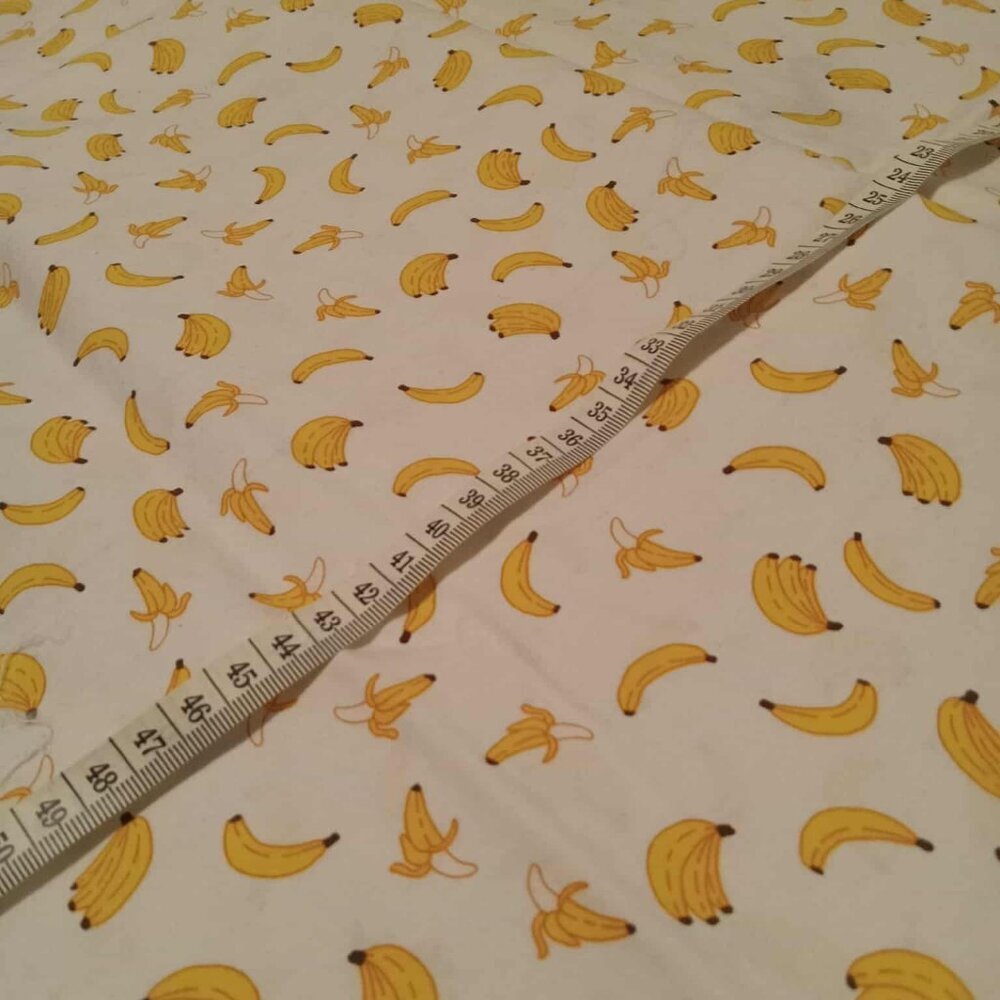Cotton fabric with banana pattern on white background